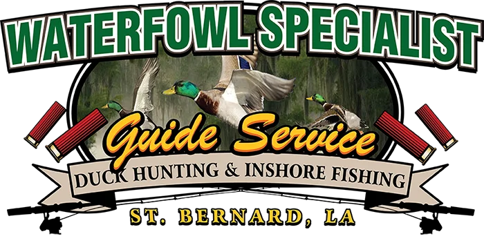 Drake Lodge exterior with wooden ramp, Waterfowl Specialist guide service sign, American flag, and marshland backdrop in St. Bernard, Louisiana.